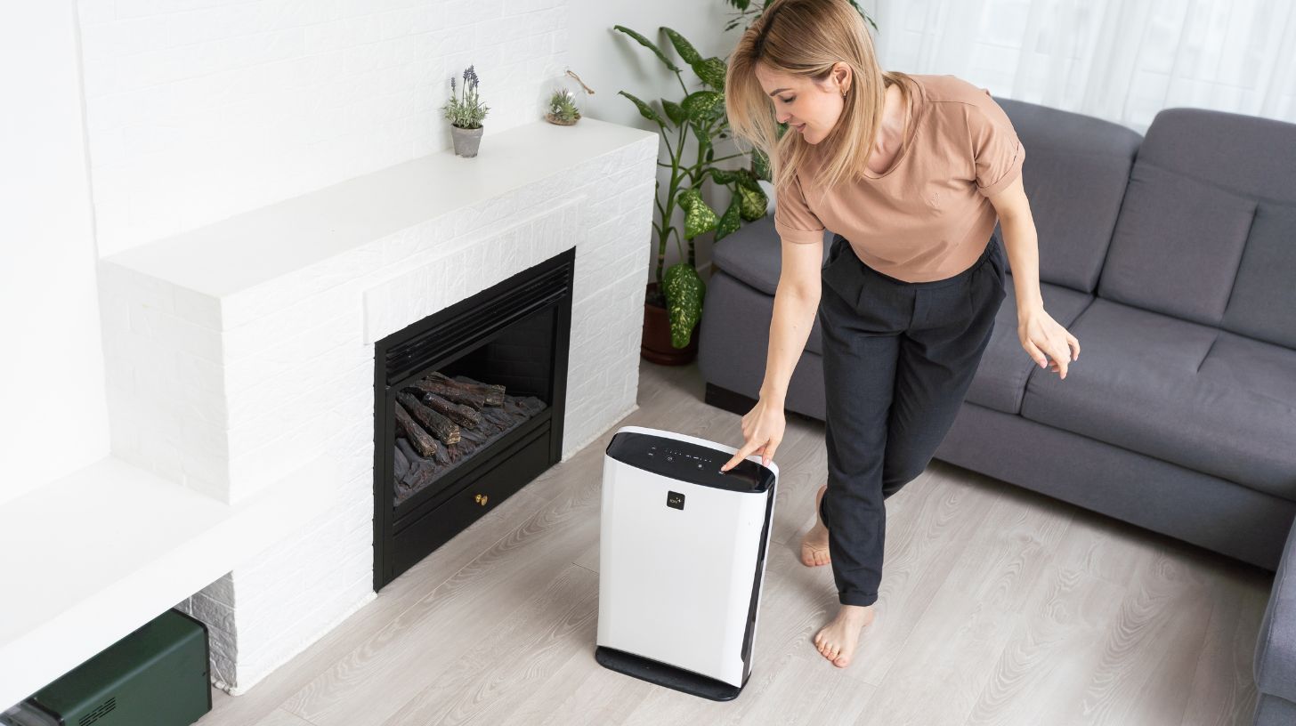 a person operating a dehumidifier