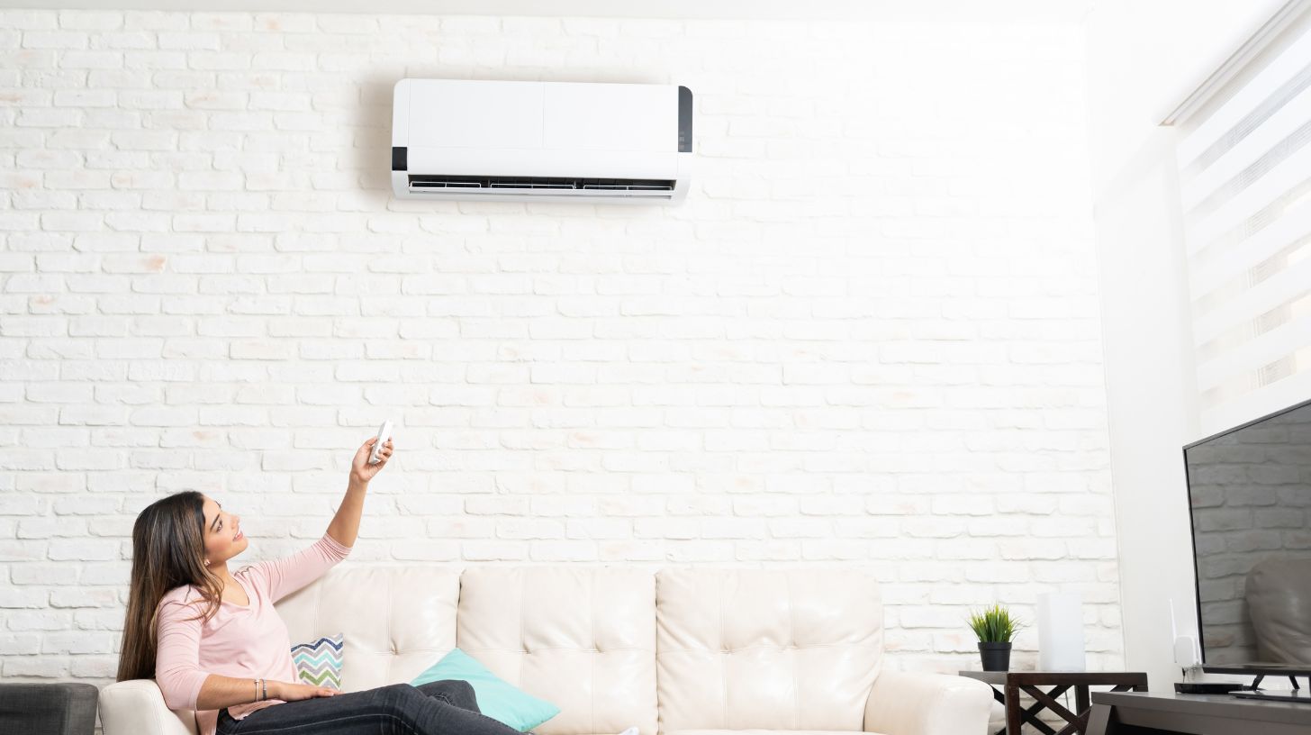 a person operating an HVAC system to prevent condensation